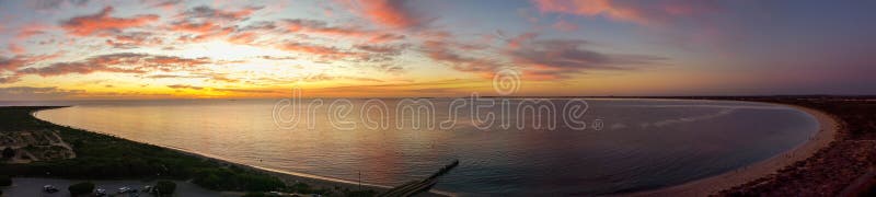 Arial sunset at Long Point Jetty with people fishing and swimming, Port Kennedy