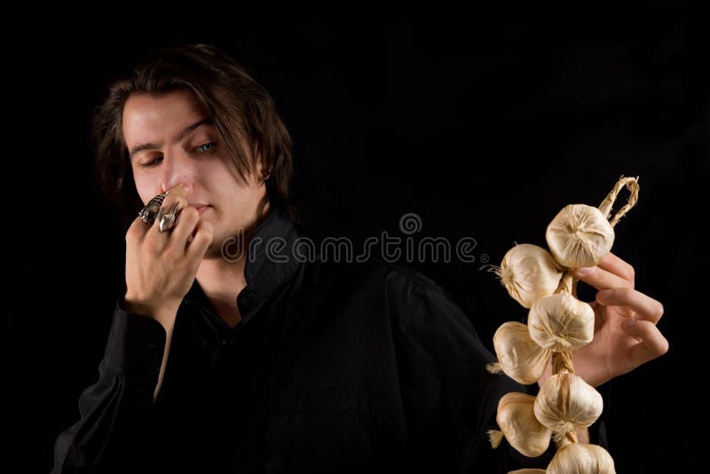 Aristocratic vampire doesn't like the garlic stock images