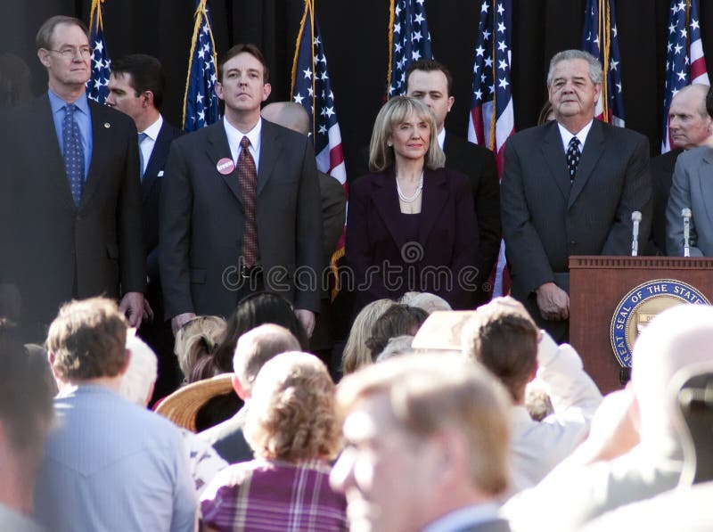 Arizona's Secretary of State, Republican Janice Brewer, sworn in at her inauguration as the new Governor of Arizona. Brewer replaces Democratic Governor Janet Napolitano who resigned to be President Barack Obama's new Secretary of Homeland Security. Brewer replaced Janet Napolitano at a time when the state faces a large budget crisis. Former Arizona state Senate President Ken Bennett replaces Brewer as Arizona's Secretary of State. Arizona's Secretary of State, Republican Janice Brewer, sworn in at her inauguration as the new Governor of Arizona. Brewer replaces Democratic Governor Janet Napolitano who resigned to be President Barack Obama's new Secretary of Homeland Security. Brewer replaced Janet Napolitano at a time when the state faces a large budget crisis. Former Arizona state Senate President Ken Bennett replaces Brewer as Arizona's Secretary of State.