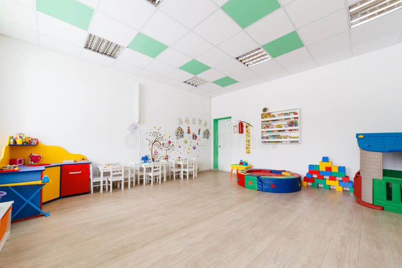 Arkhangelsk, Russia - march 3, 2018: Bright Interior of a modern kindergarten in yellow and green colors. Natural day