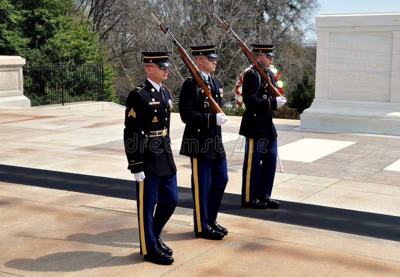 Arlington, Virginia: Three United States Marines perform the changing of the guard ceremony at the Tomb of the Unknown Soldier in Arlington National Cemetery. Arlington, Virginia: Three United States Marines perform the changing of the guard ceremony at the Tomb of the Unknown Soldier in Arlington National Cemetery.