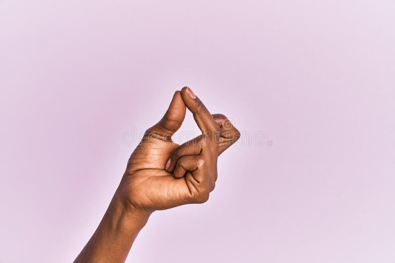 Arm And Hand Of Black Middle Age Woman Over Pink Isolated Background ...