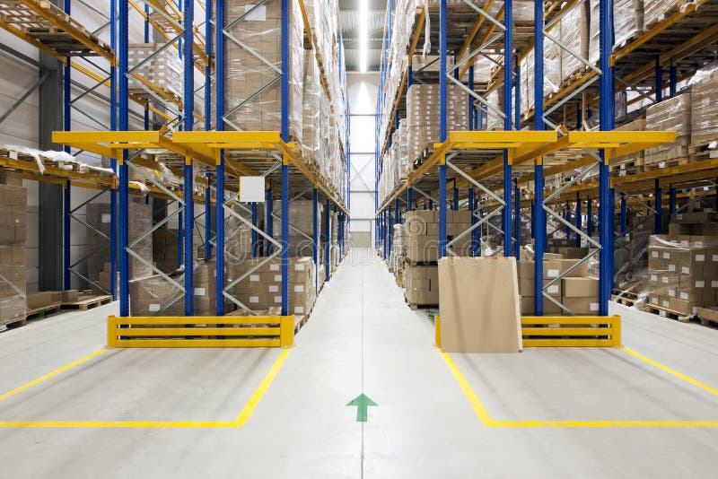Warehouse with racks and shelves, filled with cardboard boxes, wrapped in foil on wooden pallets. Warehouse with racks and shelves, filled with cardboard boxes, wrapped in foil on wooden pallets
