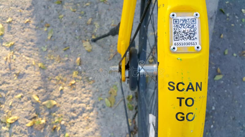 ARMENIA, YEREVAN-OCTOBER 15, 2020. A city Bicycle wheel with an inscription on it, a transition scan, and a QR code icon. The stock photo