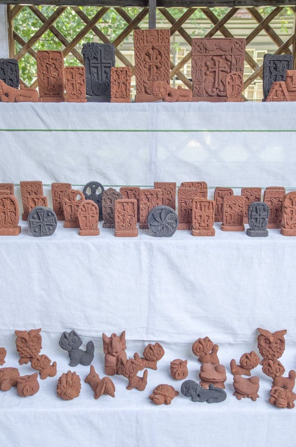 Armenian small stone souvenirs - khachkar and animals stock images Armenian small stone souvenirs - khachkar and animals stock images