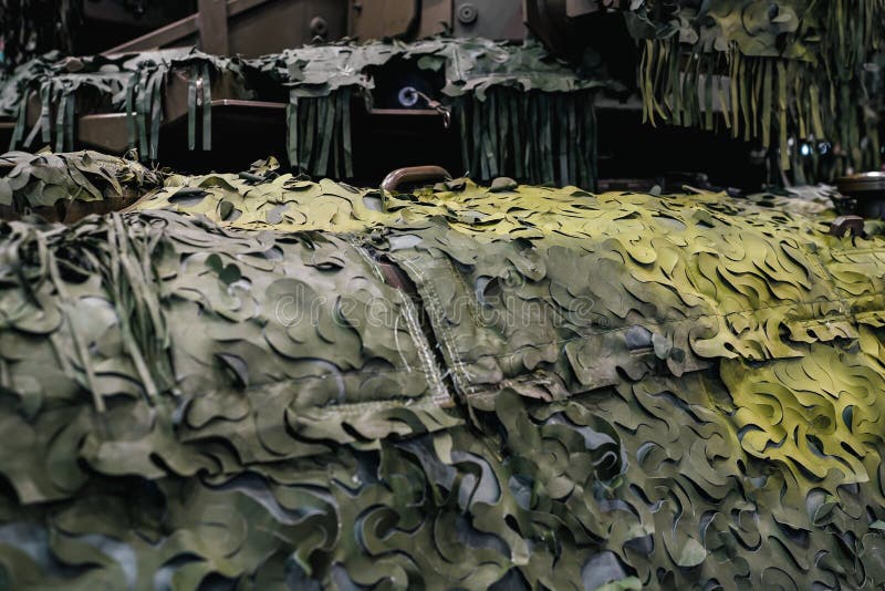 Armoured military vehicle camouflage cover - tarpaulin mesh, closeup detail royalty free stock photo