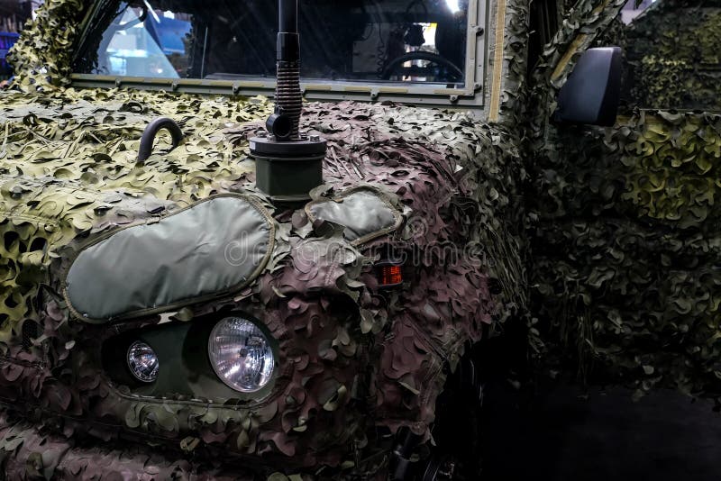 Armoured military vehicle camouflage cover - tarpaulin mesh, closeup detail royalty free stock image