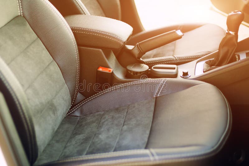 Armrest in the Luxury Passenger Car with Cup Holder between the Front
