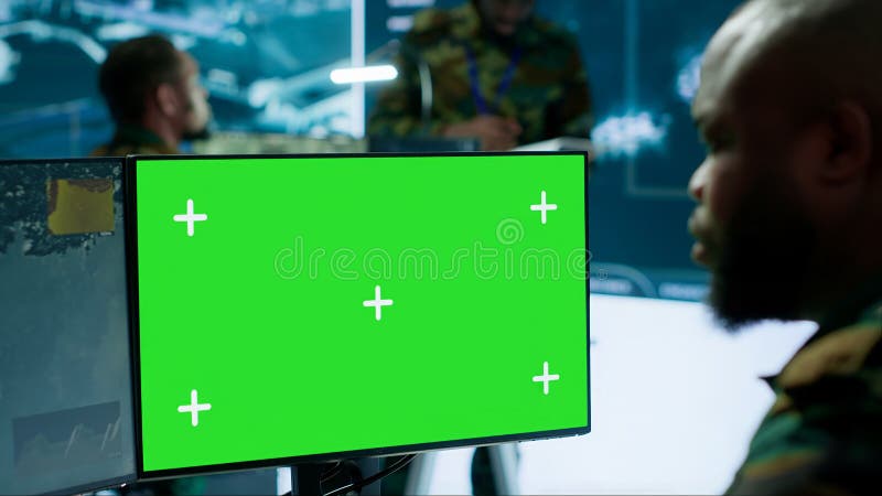 Army IT expert in control center collecting real time battlefield data stock photography