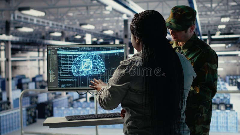Army experts in server room use artificial intelligence program stock video footage