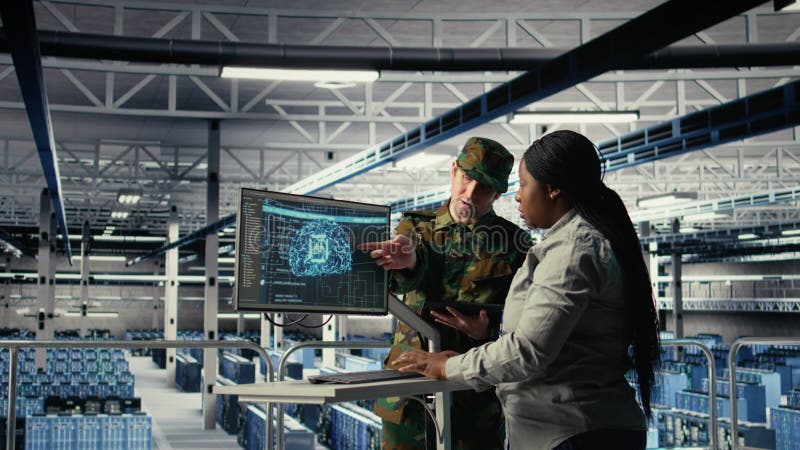 Army experts in server room use artificial intelligence program stock video