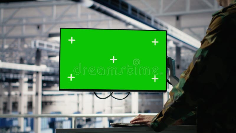 Army programmer in server hub uses AI application on green screen mockup PC stock footage