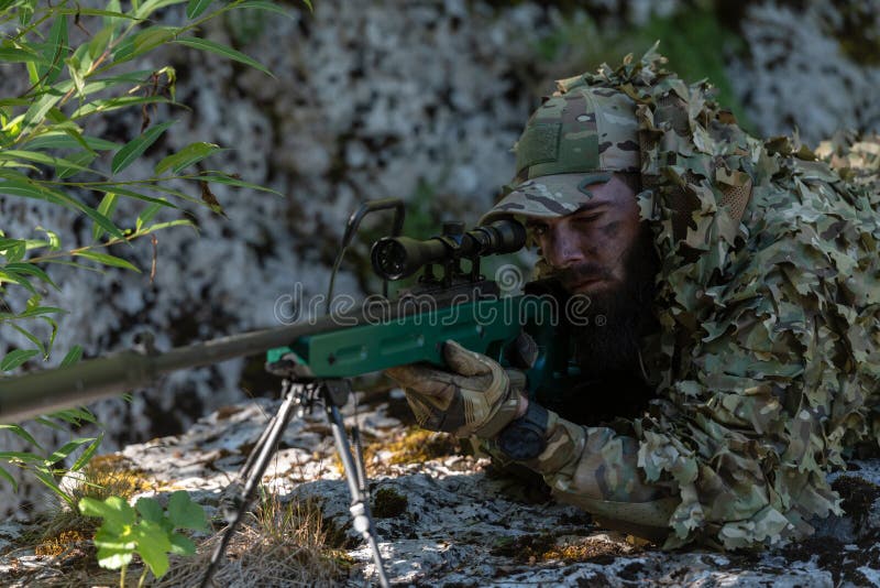 Sniper reload his rifle in forest Stock Photo by ©Nesterenko_Max 89103288