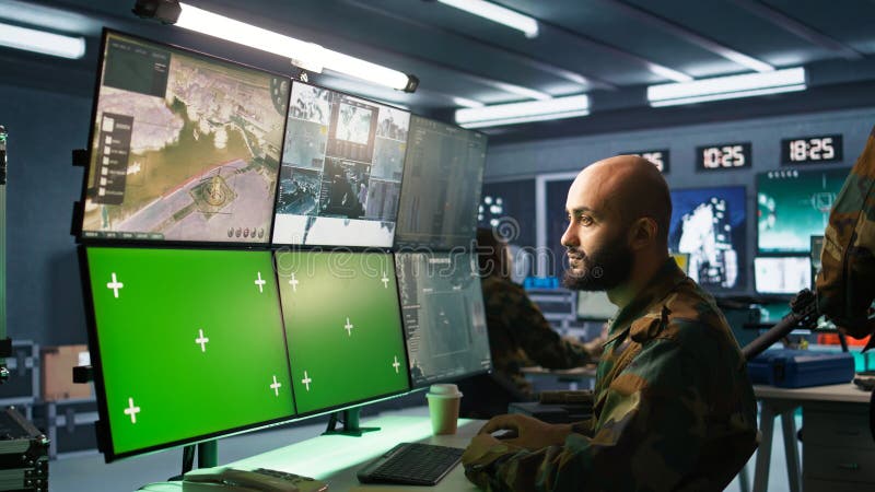 Army specialist engaging enemy forces using mockup monitors royalty free stock images