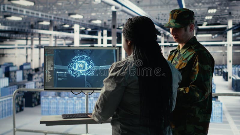 Army specialists in server room use advanced AI tools to review information stock video