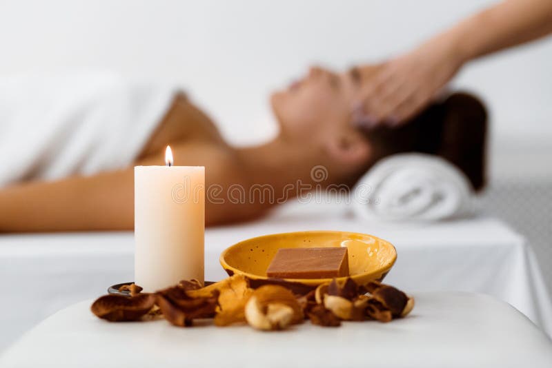 Aroma composition with candle and relaxing woman stock images Aroma composition with candle and relaxing woman stock images