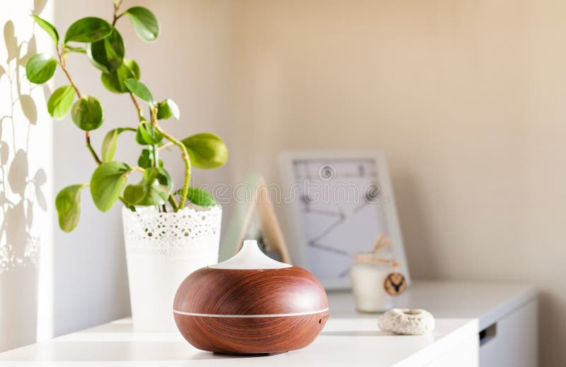 aroma oil diffuser on table at home. Air freshener