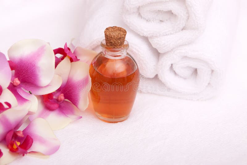 Aromatherapy oils, orchid and towels