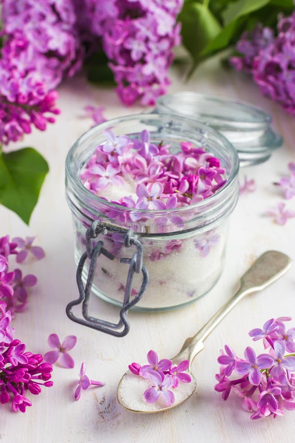 Aromatic lilac sugar on jar, selective focus on spoon