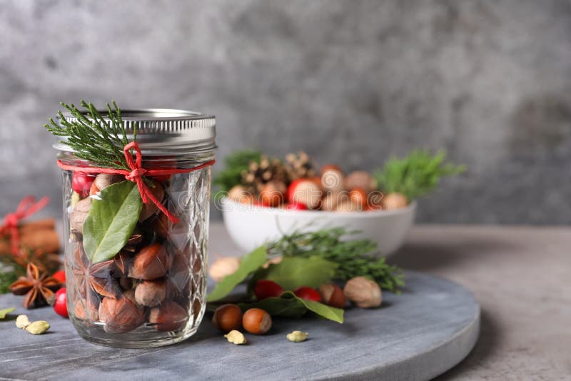 Aromatic Potpourri in Glass Jar on Grey Table. Space for Text Stock