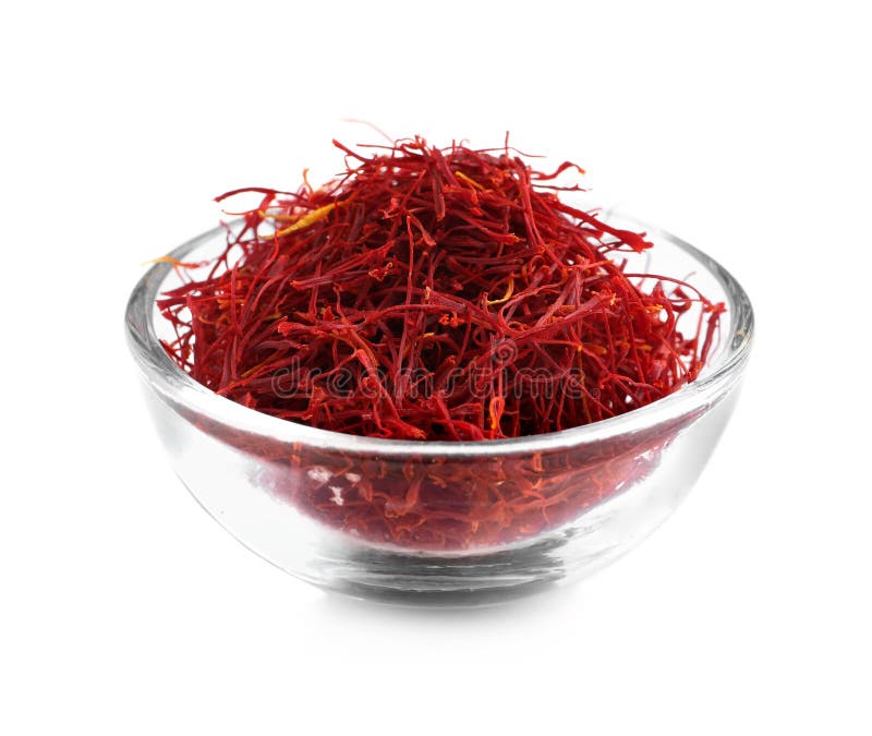 Aromatic saffron in glass bowl isolated on white stock image