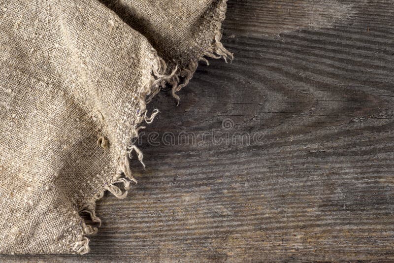 Arpillera de la arpillera que despide en fondo de madera imágenes de archivo libres de regalías Arpillera de la arpillera que despide en fondo de madera imágenes de archivo libres de regalías