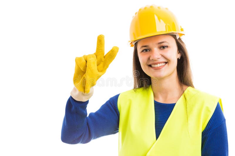 Arquiteto da jovem mulher que mostra o sinal de paz imagens de stock royalty free Arquiteto da jovem mulher que mostra o sinal de paz imagens de stock royalty free
