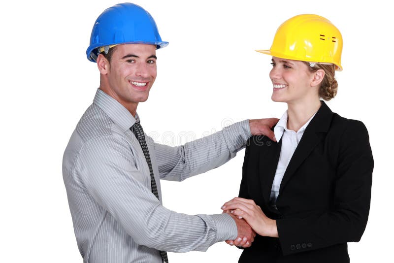 Arquitetos masculinos e fêmeas imagem de stock Arquitetos masculinos e fêmeas imagem de stock