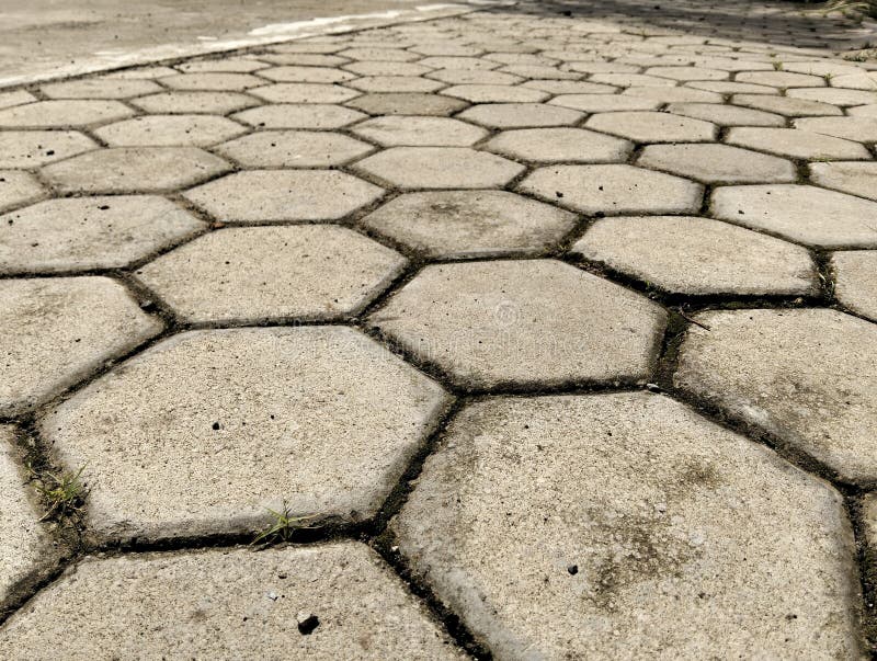 Arrangement of paving blocks made of cement in a hexagonal shape arranged in the yard royalty free stock photography