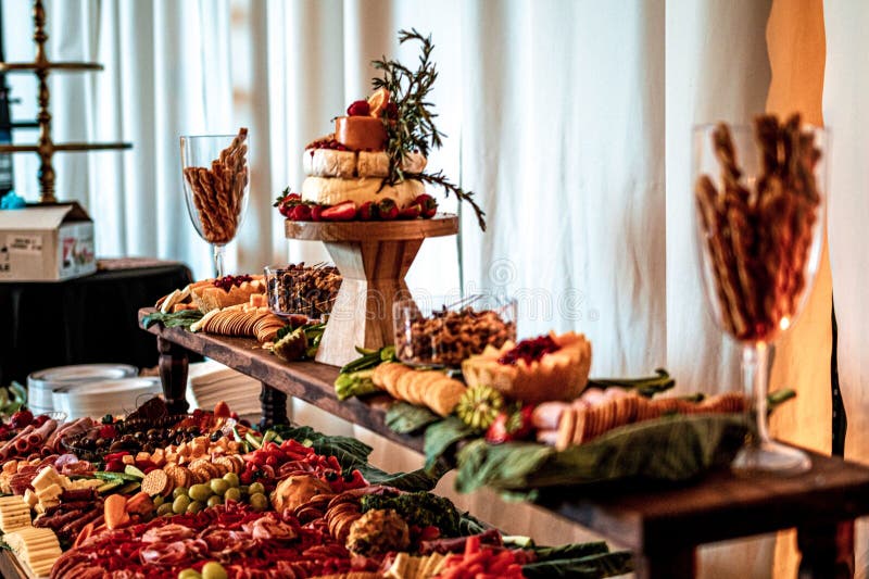 A buffet with different types of food on the table at a formal event royalty free stock images