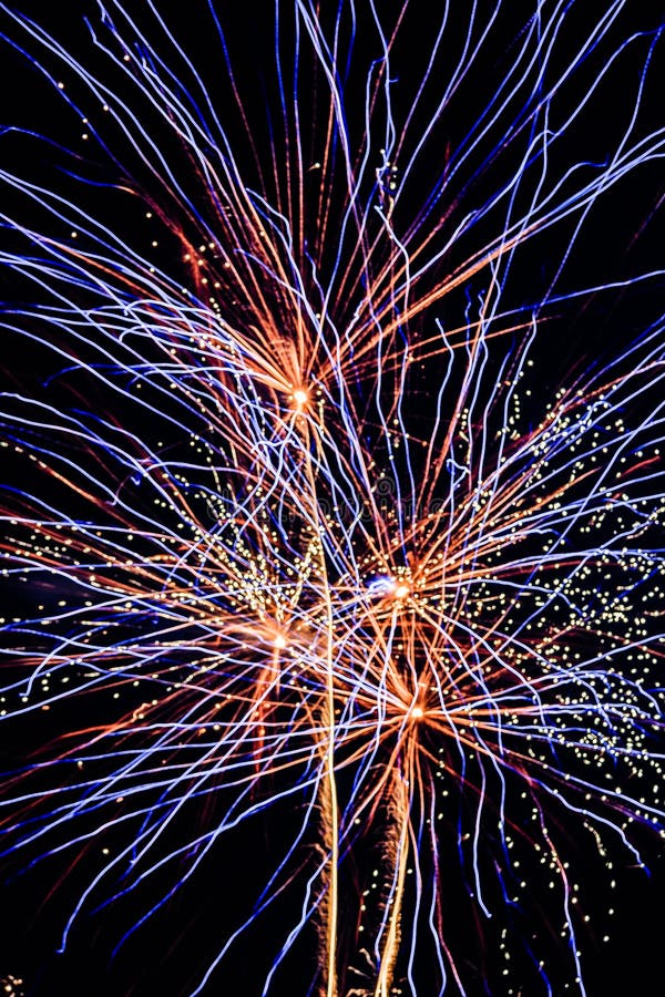 Gigantic Fireworks Explosions. Array of four firework rocket bursts occurring at a the same time.