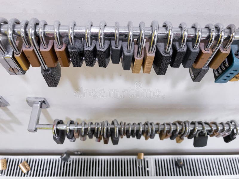 Array of pad locks hanging in a gym on the wall royalty free stock image Array of pad locks hanging in a gym on the wall royalty free stock image