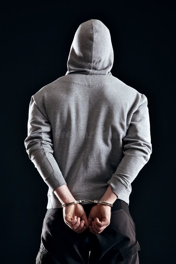 Arrested Criminal in Handcuffs stock image
