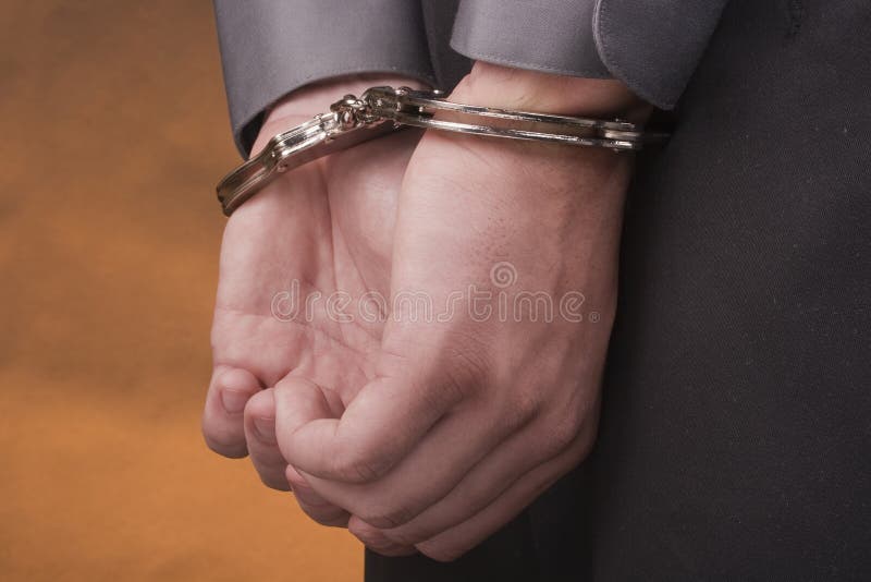 Arrested in handcuffs stock photo. Image of detention 17022814