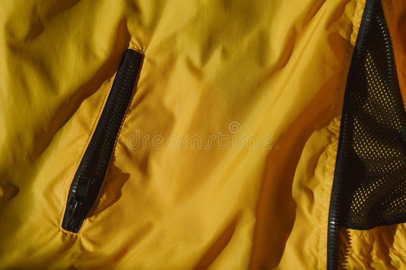 bright background for decoration. the texture of natural cotton fabric, a pocket on the jacket. stylish modern clothes. accessories for sewing. bright background for decoration. the texture of natural cotton fabric, a pocket on the jacket. stylish modern clothes. accessories for sewing.
