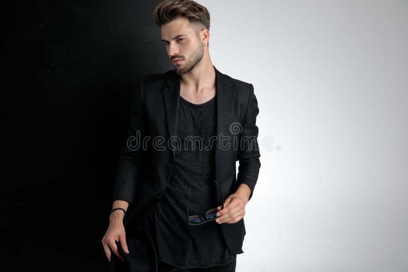 Arrogant Smart Casual Man Holding Sunglasses and Hat in Studio Stock Photo  - Image of background, grey: 159224252