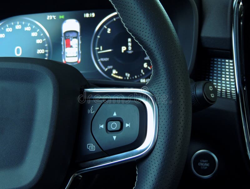 Menu Interface and Voice Control Buttons on the Steering Wheel in Car