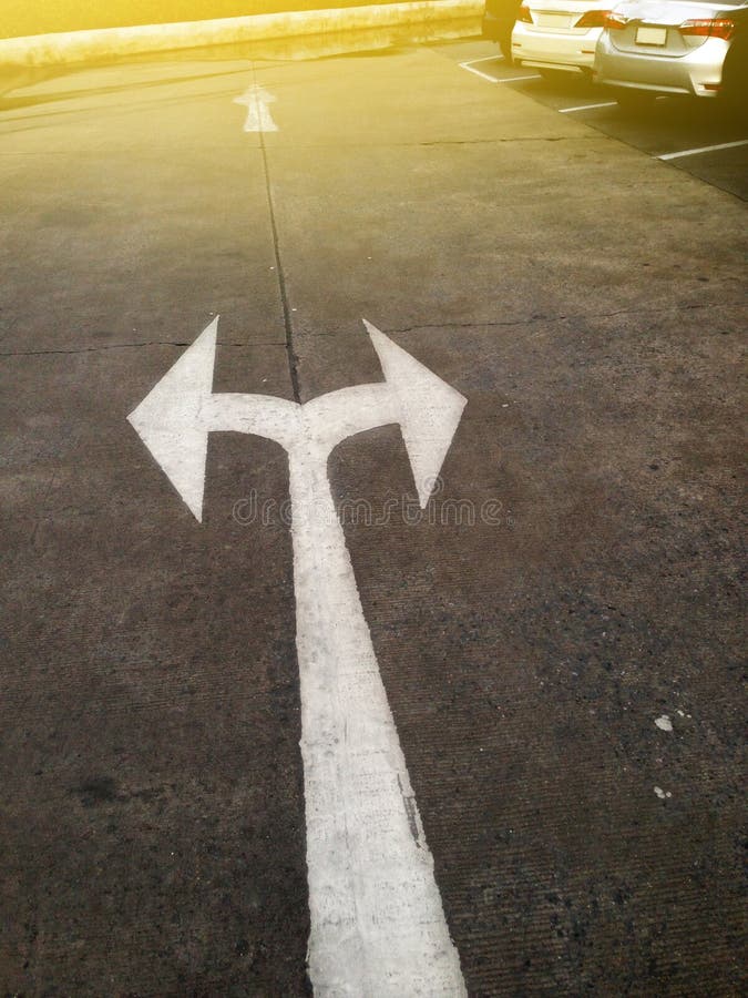 Arrow pointing left and right on ground in a car park stock photo Arrow pointing left and right on ground in a car park stock photo