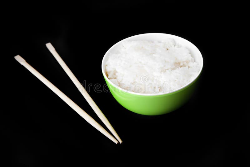 Arroz chinês com qualidade de madeira do estúdio das varas imagem de stock Arroz chinês com qualidade de madeira do estúdio das varas imagem de stock