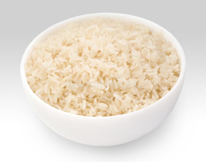Arroz de grano largo hervido en el primer blanco del cuenco imagen de archivo Arroz de grano largo hervido en el primer blanco del cuenco imagen de archivo