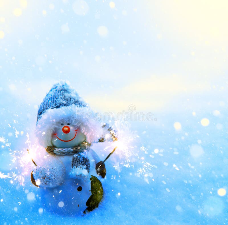 Art Christmas snowman and sparklers on blue snow background