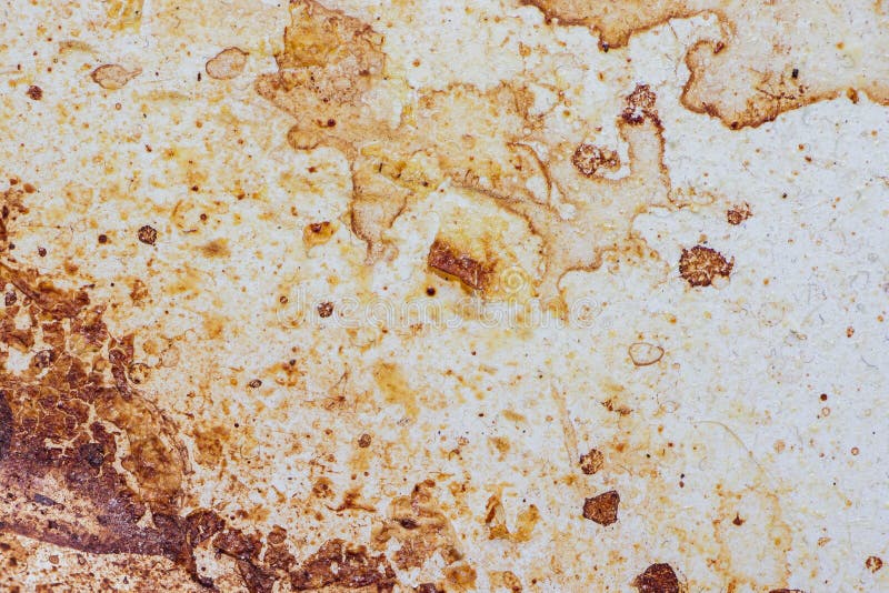 Texture of dirty stains and grease on white stove. Dried stains of fat on a white background. Texture of dirty stains and grease on white stove. Dried stains of fat on a white background