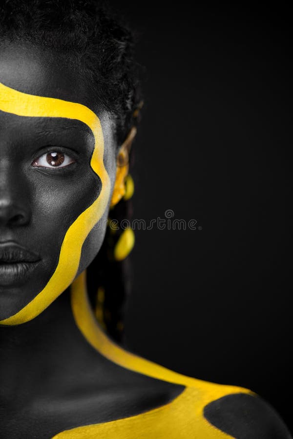 The Art Face. Black and white body paint on african woman. Abstract  creative portrait. Bright fashion makeup on the girl. Stock Photo