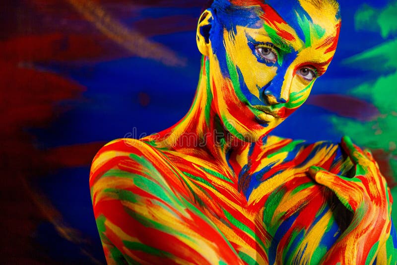 Art fashion makeup and body painting . Color face of woman for inspiration. Abstract portrait of the bright beautiful