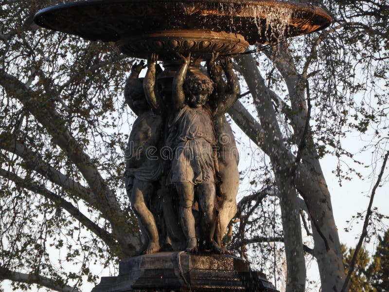 Art fountain outdoors architecture kids metal with trees at the background royalty free stock photos Art fountain outdoors architecture kids metal with trees at the background royalty free stock photos
