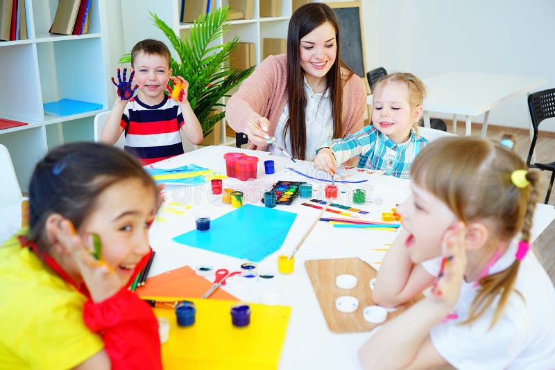 Art lesson in kindergarten stock photo. Image of girl - 91807710