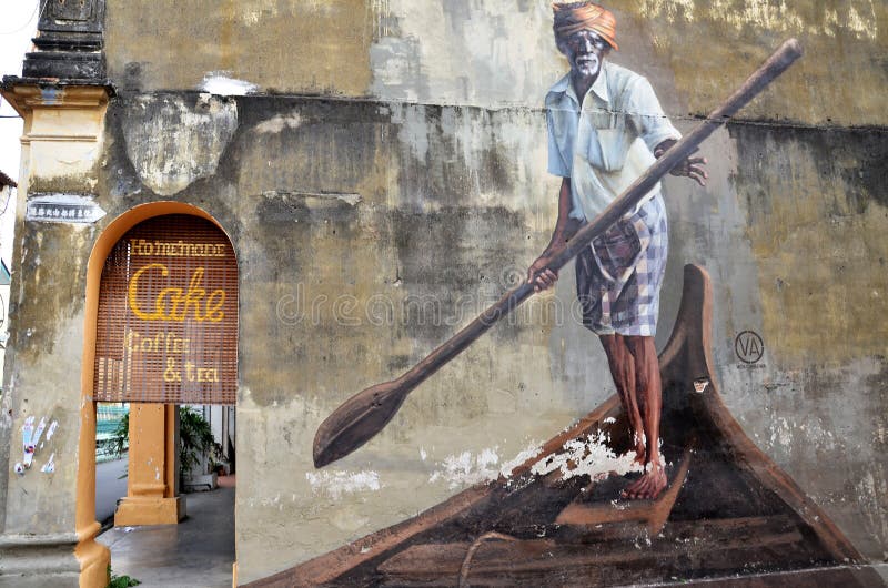 PENANG, MALAYSIA-29 DECEMBER, 2016: Public street art, The Indian Boatman, in Georgetown Penang, Malaysia. PENANG, MALAYSIA-29 DECEMBER, 2016: Public street art, The Indian Boatman, in Georgetown Penang, Malaysia.