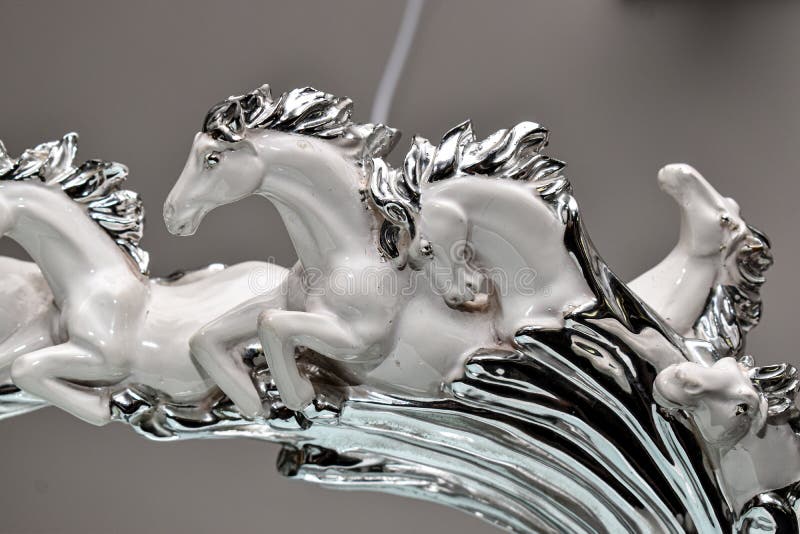 Artefact,of beautiful white horses running