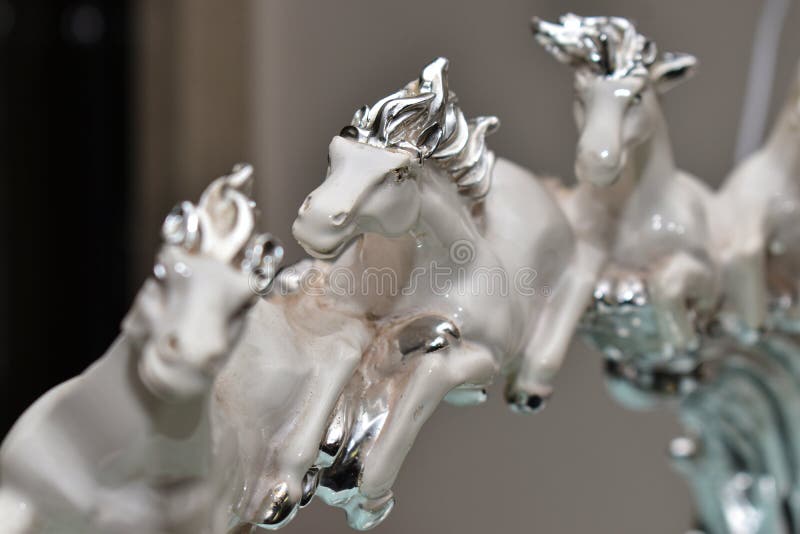Artefact of beautiful white horses running