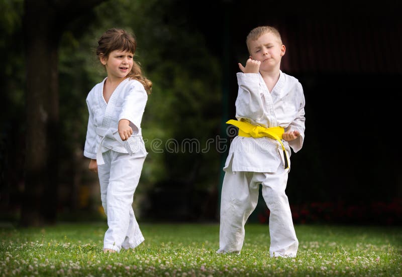 Karate kids martial Arts on the field. Karate kids martial Arts on the field